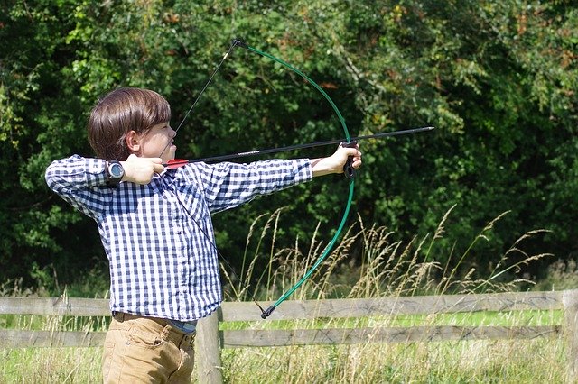Bear Creek Nature Park image of little boy doing archery