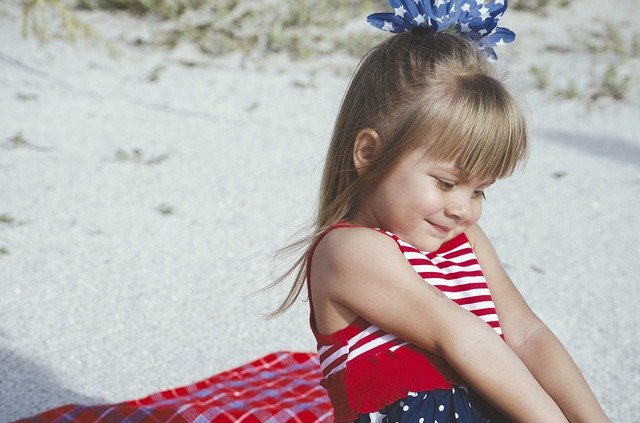 image of girl at  beach with link