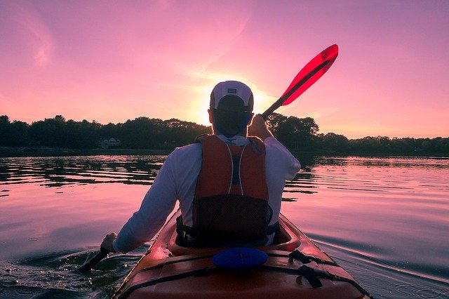 image of man kayaking