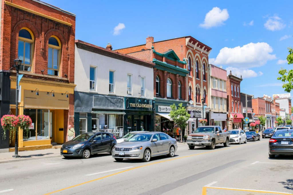 Hometown Stories main image of quaint downtown with traffic